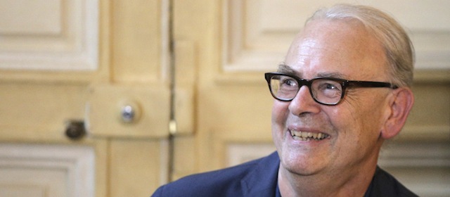 French novelist Patrick Modiano smiles during a press conference at his publishing house in Paris, Thursday, Oct. 9, 2014. Patrick Modiano, who has made a lifelong study of the Nazi occupation and its effects on his country, won the 2014 Nobel Prize in literature Thursday for what one academic called "crystal clear and resonant" prose. (AP Photo/Christophe Ena)