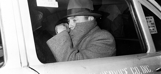 FILE - In this Nov. 16, 1960, file photo, convicted atom bomb spy David Greenglass sits in a taxi leaving New York's Federal House of Detention. The former Army sergeant whose testimony led to the conviction and execution of his sister, Ethel Rosenberg and brother-in-law, Julius Rosenberg, died on July 1. He was 92. (AP Photo/File)