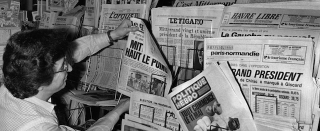 A bookseller displays the local and national newspapers in Le Havre, northern France, on May 11, 1981, the morning after the victory to the French Presidency of socialist candidate FranÁois Mitterrand. FranÁois Mitterrand is the first French socialist President ever elected by universal suffrage.AFP PHOTO MYCHEL DANIAU (Photo credit should read MYCHELE DANIAU/AFP/GettyImages)