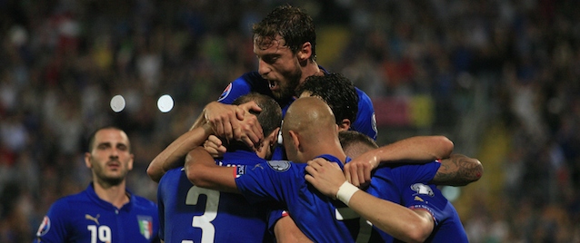 Italy's Giorgio Chiellini (3) is congratulated by teammates after scoring during the UEFA Euro 2016 group H qualifying football match between Italy and Azerbaijan on October 10, 2014 at the Renzo Barbera Stadium in Palermo. AFP PHOTO / MARCELLO PATERNOSTRO (Photo credit should read MARCELLO PATERNOSTRO/AFP/Getty Images)