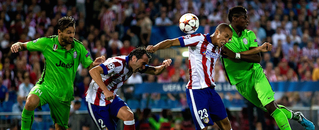 MADRID, SPAIN - OCTOBER 01: Joao Miranda (2ndR) of Atletico de Madrid wins the header against Paul Pogba (R) of Juventus during the UEFA Champions League group A match between Club Atletico de Madrid and Juventus at Vievnte Calderon Stadium on October 1, 2014 in Madrid, Spain. (Photo by Gonzalo Arroyo Moreno/Getty Images)