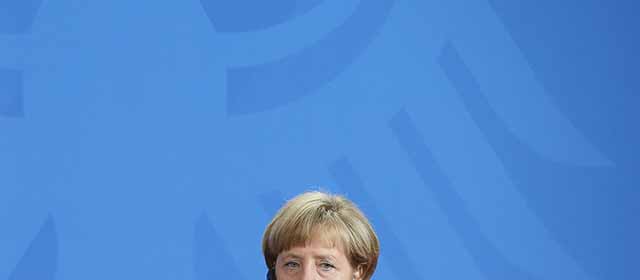 BERLIN, GERMANY - SEPTEMBER 22: German Chancellor Angela Merkel and French Prime Minister Manuel Valls speak to the media following talks at the Chancellery on September 22, 2014 in Berlin, Germany. Valls is on a two-day visit to Germany at a time when Merkel has been critical of the slow pace of French economic reforms. (Photo by Sean Gallup/Getty Images)