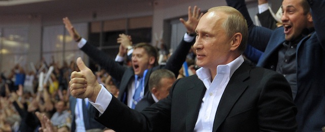 Russian President Vladimir Putin, foreground right, gestures, as he attends the Judo World Cup in the city of Chelyabinsk in Siberia, Russia, on Sunday, Aug. 31, 2014. Putin is calling on Ukraine to immediately start talks on a political solution to the crisis in eastern Ukraine, including discussing statehood. (AP Photo/RIA Novosti, Alexei Druzhinin, Presidential Press Service)