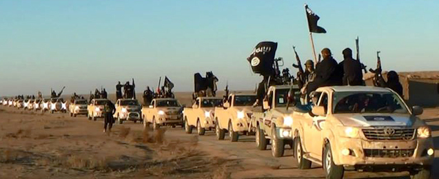 FILE - This file image posted on a militant website on Tuesday, Jan. 7, 2014, which is consistent with AP reporting, shows a convoy of vehicles and fighters from the al-Qaida linked Islamic State of Iraq and the Levant (ISIL) fighters in Iraq's Anbar Province. The past year, ISIL _ has taken over swaths of territory in Syria, particularly in the east. It has increasingly clashed with other factions, particularly an umbrella group called the Islamic Front and with Jabhat al-Nusra, or the Nusra Front, the group that Ayman al-Zawahri declared last year to be al-Qaida’s true representative in Syria. That fighting has accelerated the past month. (AP Photo via militant website, File)