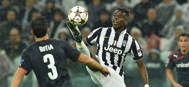 TURIN, ITALY - NOVEMBER 04: Paul Pogba of Juventus controls the ball during the UEFA Champions League group A match between Juventus and Olympiacos FC at Juventus Arena on November 4, 2014 in Turin, Italy. (Photo by Valerio Pennicino/Getty Images)