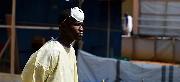A health worker stands on November 11, 2014 in the green zone of the Hastings treatment center in Hastings, outside Freetown, the only run exclusively by locals. Some 1,130 people in the impoverished west African country have died from the virus out of 4,862 cases in the current outbreak, declared a state of emergency on July 31. AFP PHOTO / FRANCISCO LEONG (Photo credit should read FRANCISCO LEONG/AFP/Getty Images)