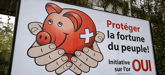 A campaign poster in favor of an initiative on Swiss gold which reads in French "Protect the people's fortune ! People's initiative on gold, yes" is seen on November 17, 2014 in Lausanne. As Switzerland prepares to vote this month on whether to force the country's central bank to increase its gold reserves, economists warn a 'Yes' vote could wreak havoc in financial markets. The initiative "Save Switzerland's gold", which will be put to a popular referendum vote on November 30, would oblige the Swiss National Bank (SNB) to boost its gold reserves to at least 20 percent of its holdings, nearly three times more than the current seven percent level. AFP PHOTO / FABRICE COFFRINI (Photo credit should read FABRICE COFFRINI/AFP/Getty Images)