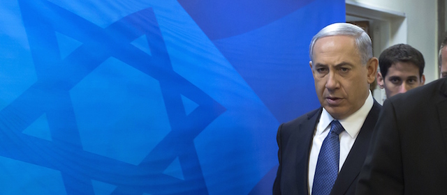 Israeli Prime Minister Benjamin Netanyahu (2nd from R) arrives to attend the weekly cabinet meeting at his Jerusalem office on November 23, 2014. Ministers were to discuss a controversial bill to anchor in law Israel's status as the national homeland of the Jewish people. AFP PHOTO / POOL / JIM HOLLANDER (Photo credit should read JIM HOLLANDER/AFP/Getty Images)