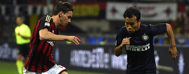 AC Milan's defender Mattia De Sciglio (L) fights for the ball with Inter Milan's Japanese midfielder Yuto Nagatomo during the Italian Seria A football match between AC Milan and Inter Milan at the San Siro stadium in Milan on May 4, 2014. AFP PHOTO / OLIVIER MORIN (Photo credit should read OLIVIER MORIN/AFP/Getty Images)