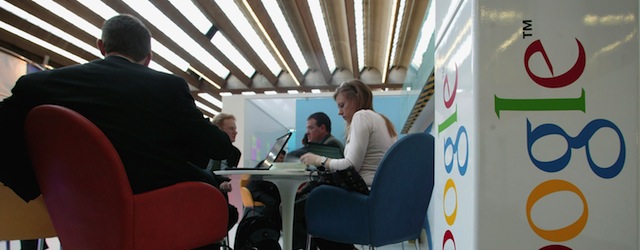 FRANKFURT, GERMANY - OCTOBER 08: Visitors sit at the Google stand at the Frankfurt book fair on October 8, 2006 in Frankfurt, Germany. On Monday October 7 Google, the biggest force in search and Internet advertising bought YouTube, a company offering online video for 1.5 billion euros in stock. (Photo by Ralph Orlowski/Getty Images)