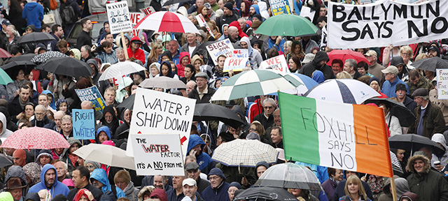 Thousands of protesters make their way through Dublin City centre, Ireland, Saturday, Nov.1, 2014. Over 100,000 protesters marched against Ireland's new tax on water, a charge imposed as part of the country's successful exit from an international bailout. (AP Photo/Peter Morrison)