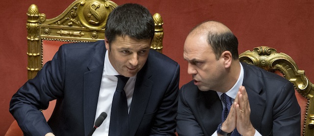 Premier Matteo Renzi, left, talks with Interior Minister Angelino Alfano, after he delivered his speech prior to a confidence vote, at the Senate, in Rome, Monday, Feb. 24, 2014. Renzi is pitching for support in Parliament ahead of mandatory confidence votes on his brand-new coalition. Democratic Party leader Renzi told the Senate Monday he needs support for a "bold vision" that will get economically stagnate Italy dreaming again. Without giving details, Renzi said debt-laden Italy must heal its public finances not because Germany's leader, Angela Merkel or the European Central Bank chief want us "to get serous" but because "it's our children" who seek a future. (AP Photo/Andrew Medichini)