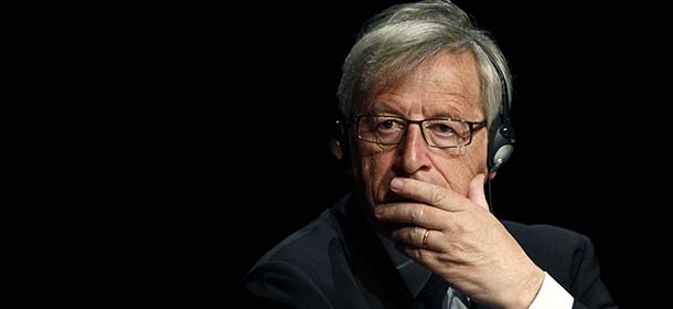 FILE - In this June 10, 2013 file photo, Luxembourg Prime Minister and former Eurogroup chief Jean-Claude Juncker listens to another speaker just before delivering a speech on the future of the Eurozone, in Athens. Luxembourg Prime Minister Jean-Claude Juncker has announced he will offer the resignation of his government on Thursday June 11, 2013, and call for early elections. The Christian Democrat was forced to take the measure after his Socialist coalition partner withdrew its support and insisted he should take political responsibility for an old secret service scandal which centered on snooping on local politicians. Juncker denied any knowledge. (AP Photo/File)