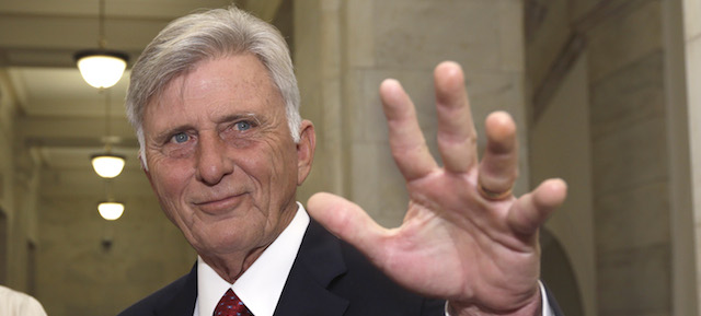 Arkansas Gov. Mike Beebe waves as he talks to reporters in a hallway at the Arkansas state Capitol in Little Rock, Ark., Wednesday, Nov. 5, 2014. (AP Photo/Danny Johnston)
