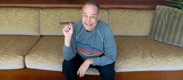 This Aug. 12, 2013 photo shows Sam Simon, co-creator of "The Simpsons," at his home in Pacific Palisades, Calif. Simon, 58, was diagnosed with colorectal cancer last November. Having defied that diagnosis' sentence _ three to six months to live _ Simon continues to push ahead, broaching no defeat. (AP Photo/Frazier Moore)