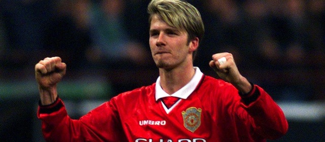 FILE - In this March 17, 1999, file photo, Manchester United's David Beckham celebrates as he leaves the field after his team tied 1-1 with Inter Milan in a Champions League second leg quarterfinal match at Milan's San Siro stadium. The 38-year-old midfielder, who recently won a league title in a fourth country with Paris Saint-Germain, said Thursday, May 16, 2013, he will retire after the season. (AP Photo/Alex Trovati, File)