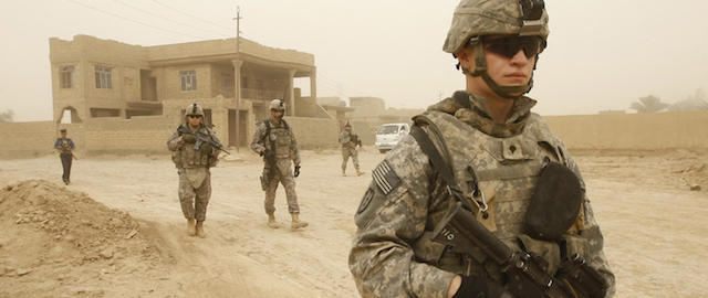 US soldiers and Iraqi police carry out their last patrol along the streets of Khan Bani Saad some 10 kms south of the town of Baquba on June 28 2009, as a sandstorm engulfs this northeastern region of the county. US combat troops will pull out from Iraq's cities and main towns June 30 as the war-torn country takes sole charge of security in a major stepping stone to a complete American withdrawal. AFP PHOTO / AHMAD AL-RUBAYE (Photo credit should read AHMAD AL-RUBAYE/AFP/Getty Images)