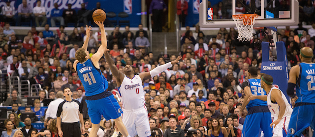 LOS ANGELES, CA - APRIL 3: Dirk Nowitzki of the Dallas Mavericks shoots the ball over Glen Davis #0 of the Los Angeles Clippers on April 3, 2014 at Staples Center in Los Angeles, California. NOTE TO USER: User expressly acknowledges and agrees that, by downloading and or using this photograph, User is consenting to the terms and conditions of the Getty Images License Agreement. (Photo by Mpu Dinani/Getty Images)