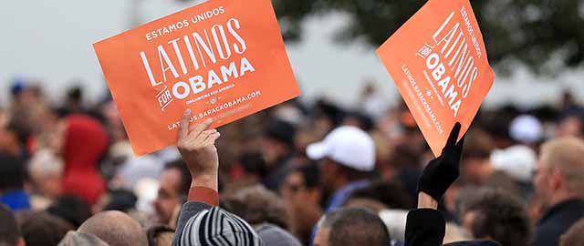 DENVER, CO - OCTOBER 04: Latino supporters hold up signs as they attend a campaign rally for U.S. President Barack Obama at Sloan's Lake Park on October 4, 2012 in Denver, Colorado. Obama spoke the morning after the first Presidential debate at the University of Denver. (Photo by Doug Pensinger/Getty Images)