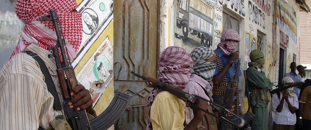 Al-Shabaab insurgents seen with arms, in Mogadishu, Somalia, Saturday Dec. 27, 2008. Clashes between two rival Islamist militias in a central Somali town have killed at least ten people, witnesses said Saturday, as speculation continued over whether the president of Somalia's ineffectual U.N.-backed government would resign. (AP Photo/Farah Abdi Warsameh)
