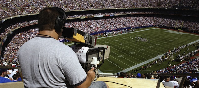 EAST RUTHERFORD, NJ - SEPTEMBER 7: A television cameraman covers the game between the New York Giants and the St. Louis Rams at Giants Stadium on September 7, 2003 in East Rutherford, New Jersey. The Giants won 23-13. (Photo by Doug Pensinger/Getty Images)
