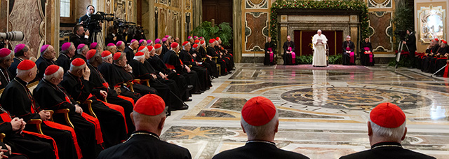 Pope Francis speaks during the audience of the Curia, the administrative apparatus of the Holy See, for Christmas greetings in the Sala Clementina of the Apostolic Palace at the Vatican, on December 21, 2013. AFP PHOTO POOL / CLAUDIO PERI (Photo credit should read CLAUDIO PERI/AFP/Getty Images)