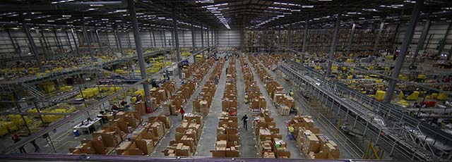 HEMEL HEMPSTEAD, ENGLAND - DECEMBER 05: Parcels are prepared for dispatch at Amazon's warehouse on December 5, 2014 in Hemel Hempstead, England. In the lead up to Christmas, Amazon is experiencing the busiest time of the year. (Photo by Peter Macdiarmid/Getty Images)
