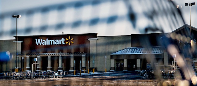 This photo shows Wal-Mart with a shopping cart in the foreground in Hayden, Idaho, Tuesday, Dec. 30, 2014. A 2-year-old boy accidentally shot and killed his mother after he reached into her purse at the northern Idaho Wal-Mart and her concealed gun fired, authorities said Tuesday. (AP Photo/The Spokesman-Review, Kathy Plonka) COEUR D'ALENE PRESS OUT