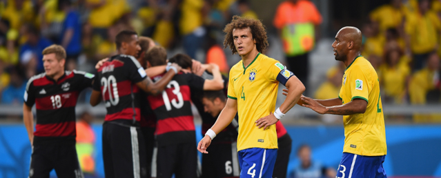 BELO HORIZONTE, BRAZIL - JULY 08: David Luiz and Maicon of Brazil react after allowing a goal during the 2014 FIFA World Cup Brazil Semi Final match between Brazil and Germany at Estadio Mineirao on July 8, 2014 in Belo Horizonte, Brazil. (Photo by Laurence Griffiths/Getty Images)