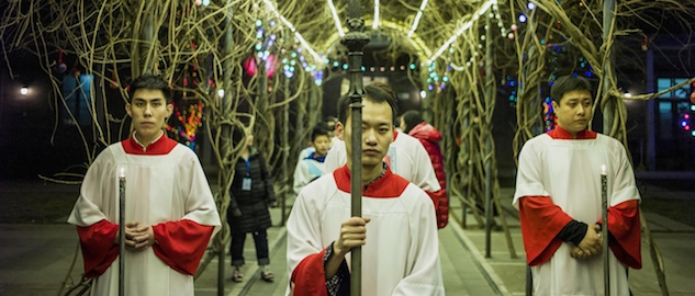 Young Chinese worshippers attend the Christmas Eve mass at a Catholic church in Beijing on December 24, 2014 as Christians around the world prepare to celebrate the holy day. AFP PHOTO / FRED DUFOUR (Photo credit should read FRED DUFOUR/AFP/Getty Images)