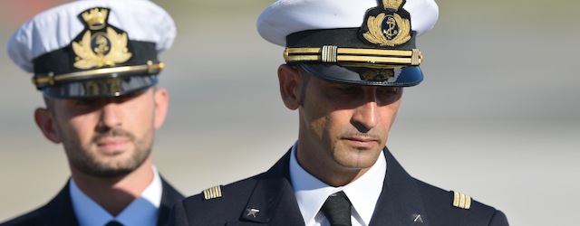 (FILES) In this photograph taken on December 22, 2012, Italian marines Massimiliano Latorre (R) and Salvatore Girone (L) arrive at Ciampino airport near Rome, on December 22, 2012. India's Supreme Court ruled February 22, 2013 that two Italian marines accused of murdering Indian fishermen while guarding an oil tanker could return home to cast their votes in upcoming national elections. The marines are suspected of shooting dead two fishermen off India's southwestern coast near the port city of Kochi in February 2012, when a fishing boat came close to the Italian oil tanker they were guarding. AFP PHOTO/ VINCENZO PINTO/ FILES (Photo credit should read VINCENZO PINTO/AFP/Getty Images)