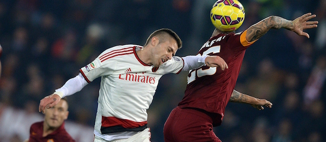 Roma's defender from Greece Jose Holebas (R) vies with AC Milan's midfielder from France Jeremy Menez during Serie A football match in Rome's Olympic Stadium on December 20, 2014. AFP PHOTO / FILIPPO MONTEFORTE (Photo credit should read FILIPPO MONTEFORTE/AFP/Getty Images)