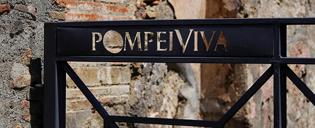 In this May 14, 2014 photo, a gate keeps tourists away from sensitive areas of the ruins of Pompeii, located near modern-day Naples, Italy. The ancient town of Pompeii was destroyed in A.D. 79 following the eruption of Mount Vesuvius. An estimated 2.5 million people visit the ruins each year. (AP Photo/Michelle Locke)