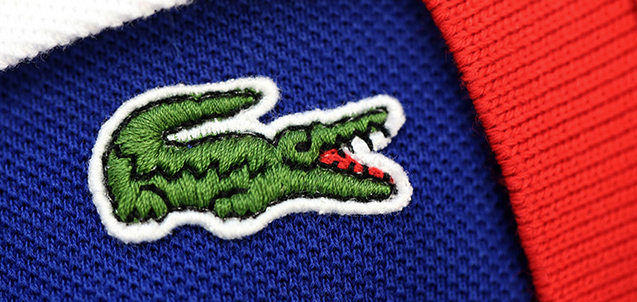 The crocodile shaped logo of French apparel company Lacoste is pictured on a polo, on January 9, 2013 in Paris. AFP PHOTO THOMAS SAMSON (Photo credit should read THOMAS SAMSON/AFP/Getty Images)