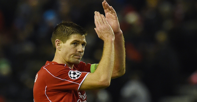 Liverpool's English midfielder Steven Gerrard applauds the fans at the end of the UEFA Champions League group B football match between Liverpool and Basel at Anfield in Liverpool, north west England, on December 9, 2014. The final score was 1-1. AFP PHOTO / PAUL ELLIS (Photo credit should read PAUL ELLIS/AFP/Getty Images)