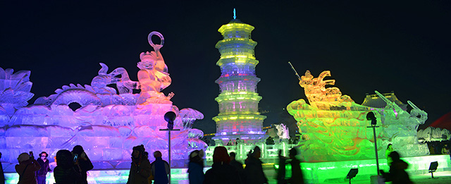 HARBIN, CHINA - JANUARY 05: (CHINA OUT) Visitors look at ice sculptures during the opening of the 30th Harbin International Ice &amp; Snow Sculpture Festival on January 5, 2014 in Harbin, Heilongjiang province of China. (Photo by ChinaFotoPress/ChinaFotoPress via Getty Images)