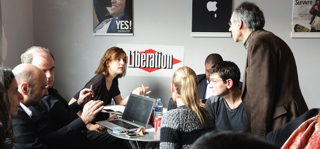 Editor-in-chief of French satirical weekly Charlie Hebdo Gerard Briard (R), Charlie Hebdo lawyer Richard Malka (L) and Charlie Hebdo financial director Eric Portheault gather at the headquarters of Liberation on January 9, 2015 in Paris, as editorial staff of French satirical newspaper Charlie Hebdo and Liberation gather following the deadly attack that occurred on January 7 by armed gunmen on the Paris offices of Charlie Hebdo. AFP PHOTO / BERTRAND GUAY (Photo credit should read BERTRAND GUAY/AFP/Getty Images)