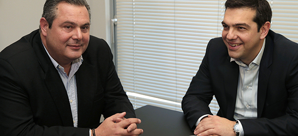 Alexis Tsipras, (R) leader of Greece's Syriza left-wing main opposition party and Panos Kammenos, chairman of Independend Greeks party speak during their meeting in Athens, Monday, Jan. 26, 2015. AFP PHOTO / POOL/ Lefteris Pitarakis (Photo credit should read LEFTERIS PITARAKIS/AFP/Getty Images)