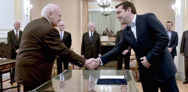 Syriza's leader Alexis Tsipras (R) shakes hands with Greece's President Karolos Papoulias (L) as he is sworn in as Greek Prime Minister at the Presidential Palace in Athens on January 26, 2015. Tsipras' party took more than 36 percent of the vote in Sunday's general election, becoming the first elected movement in Europe openly opposed to austerity. AFP PHOTO / ARIS MESSINIS (Photo credit should read ARIS MESSINIS/AFP/Getty Images)