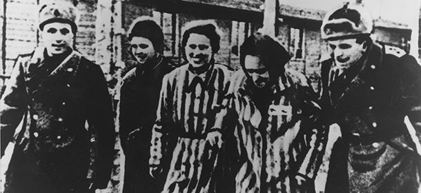 Two Auschwitz prisoners with Soviet soldiers smile after the Nazi concentration camp Auschwitz, Poland was liberated by the Russians, January 1945. (AP Photo)