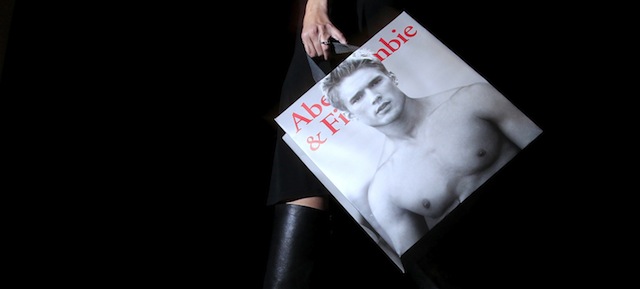 In this Nov. 14, 2011 photo, a shopper carries her Abercrombie &amp; Fitch purchase, in Phoenix. Abercrombie &amp; Fitch said Wednesday, Nov. 16, 2011, its third-quarter net income edged up nearly 2 percent as higher costs for commodities such as cotton offset higher sales of its preppy t-shirts and jeans. (AP Photo/Ross D. Franklin)