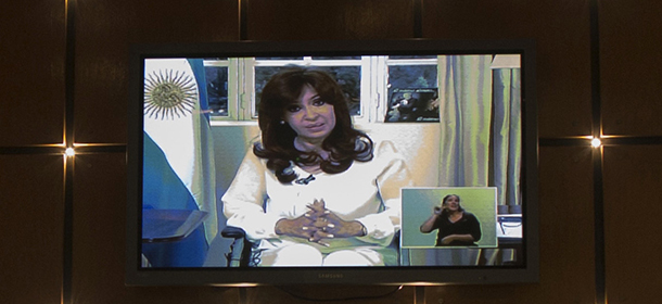 A television screen in a restaurant shows a nationally televised address by Argentina's President Cristina Fernandez, her first public comments since the death of prosecutor Alberto Nisman, in Buenos Aires, Argentina, Monday, Jan. 26, 2015. Fernandez called on Congress to dissolve Argentina's intelligence services in the wake of the mysterious death of Nisman, strongly denying his accusations that she had sought to shield former Iranian officials suspected in the 1994 bombing of a Jewish center. (AP Photo/Ivan Fernandez)