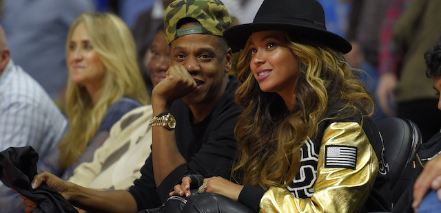 Singers Jay-Z and Beyonce watch the Los Angeles Clippers play the Cleveland Cavaliers during the second half of an NBA basketball game, Friday, Jan. 16, 2015, in Los Angeles. The Cavaliers won 126-121. (AP Photo/Mark J. Terrill)