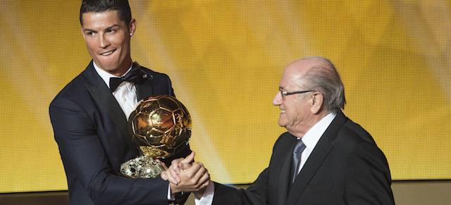Cristiano Ronaldo, left, of Portugal is being congratulated by FIFA President Joseph Blatter after winning the FIFA Men's soccer player of the year 2014 prize at the FIFA Ballon d'Or awarding ceremony at the Kongresshaus in Zurich, Switzerland, Monday, Jan. 12, 2015. (AP Photo/KEYSTONE,Ennio Leanza)