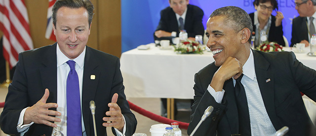 U.S. President Barack Obama, right, smiles as he listens to British Prime Minister David Cameron, during a G7 working session in Brussels, Belgium, Thursday, June 5, 2014. (AP Photo/Charles Dharapak)
