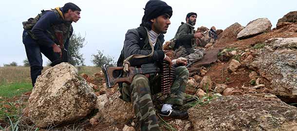 Fighters from the Al-Nusra Front, Al-Qaeda's Syria branch, hold a position as they fight against forces loyal to the regime on December 19, 2014 in the southern countryside of Syria's northern city of Aleppo. Al-Qaeda fighters in Syria seized dozens of tanks and armoured personnel carriers from the army when they took two regime bases this week in the northwestern province of Idlib, the Syrian Observatory for Human Rights said. AFP PHOTO / AMC / FADI AL-HALABI (Photo credit should read Fadi al-Halabi/AFP/Getty Images)