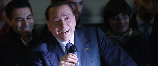 Silvio Berlusconi speaks during a Forza Italia party rally 'No Tax Day' in Milan, Italy, Saturday, Nov. 29, 2014. (AP Photo/Luca Bruno)