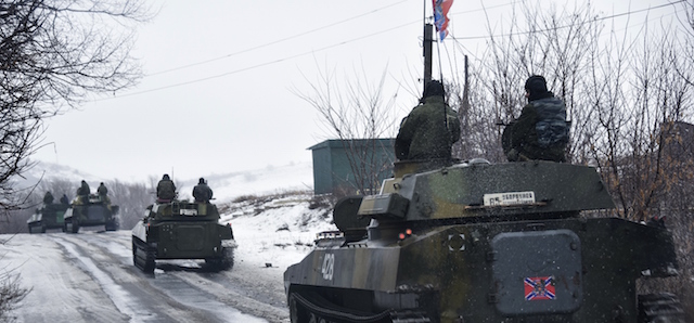 A pro-Russian armored vehicle moves toward Slovyanoserbsk, eastern Ukraine, Wednesday, Jan. 21, 2015. Moscow has proposed restoring a previously agreed line of division in eastern Ukraine to end an escalation of fighting near Donetsk, and has secured rebel agreement to pull back heavy weapons behind it, Russian foreign minister said Wednesday. (AP Photo/Mstyslav Chernov)