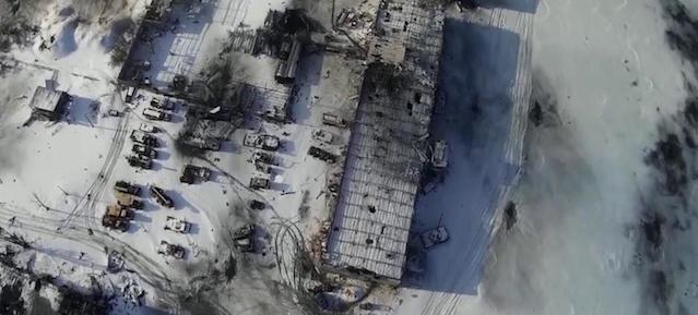 An aerial footage shot by a drone shows buildings of the Sergey Prokofiev International Airport damaged by shelling during fighting between pro-Russian separatists and Ukrainian government forces, in Donetsk, eastern Ukraine in this still image taken from a January 15, 2015 handout video by Army.SOS, a Ukrainian group that supports the army by buying ammunition, food and supplies for soldiers. Fighting raged on Saturday at the main airport of Ukraine's city of Donetsk as separatists resumed attempts to break the tenuous grip of government forces on the complex and Kiev's military said three more Ukrainian soldiers had been killed. Image taken January 15, 2015. REUTERS/Army.SOS/Handout via Reuters (UKRAINE - Tags: POLITICS CIVIL UNREST CONFLICT) ATTENTION EDITORS - THIS PICTURE WAS PROVIDED BY A THIRD PARTY. REUTERS IS UNABLE TO INDEPENDENTLY VERIFY THE AUTHENTICITY, CONTENT, LOCATION OR DATE OF THIS IMAGE. THIS PICTURE IS DISTRIBUTED EXACTLY AS RECEIVED BY REUTERS, AS A SERVICE TO CLIENTS. FOR EDITORIAL USE ONLY. NOT FOR SALE FOR MARKETING OR ADVERTISING CAMPAIGNS. NO SALES. NO ARCHIVES