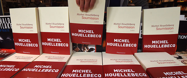 A bookseller displays French author Michel Houellebecq's new book "Soumission" ("Submission") on January 6, 2015 in a book shop in Paris. "Soumission", the sixth novel by Houellebecq -- one of France's best-known and most widely translated authors -- deals with a subject matter very likely to stir debate in a France, which is undergoing political and economic turmoil. AFP PHOTO / DOMINIQUE FAGET (Photo credit should read DOMINIQUE FAGET/AFP/Getty Images)